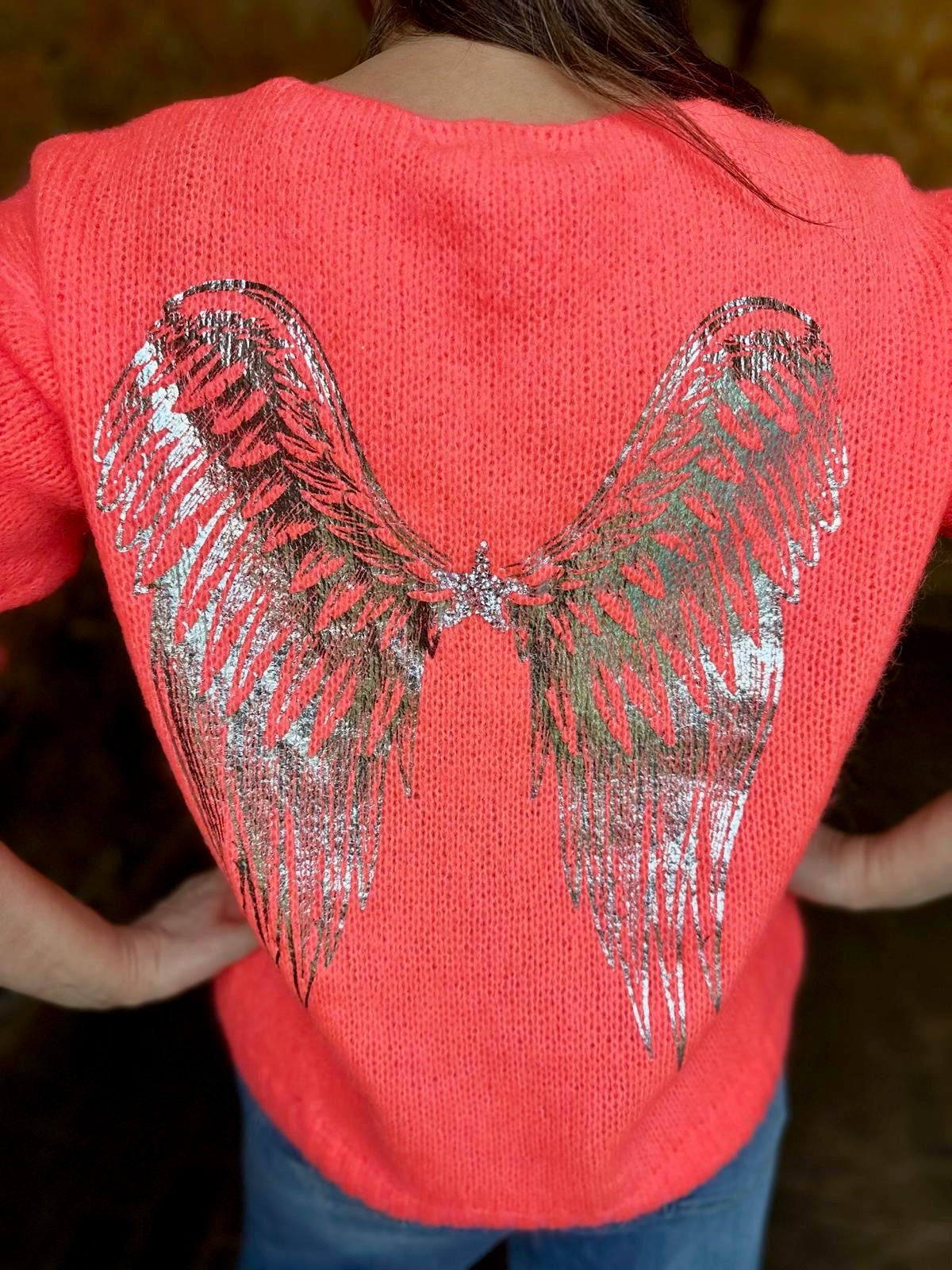 Alas de ángel tejidas en coral